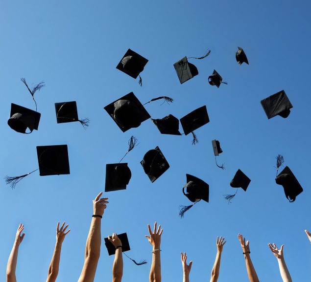 graduation-caps-air-blue-sky